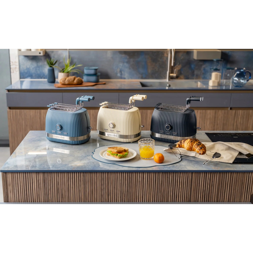 Guzzini - Tosatapane con pinze Sous Chef crema | Rohome