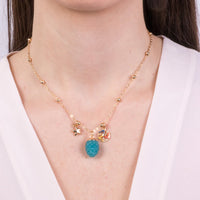 Collana in metallo con pendente pigna blu | Rohome